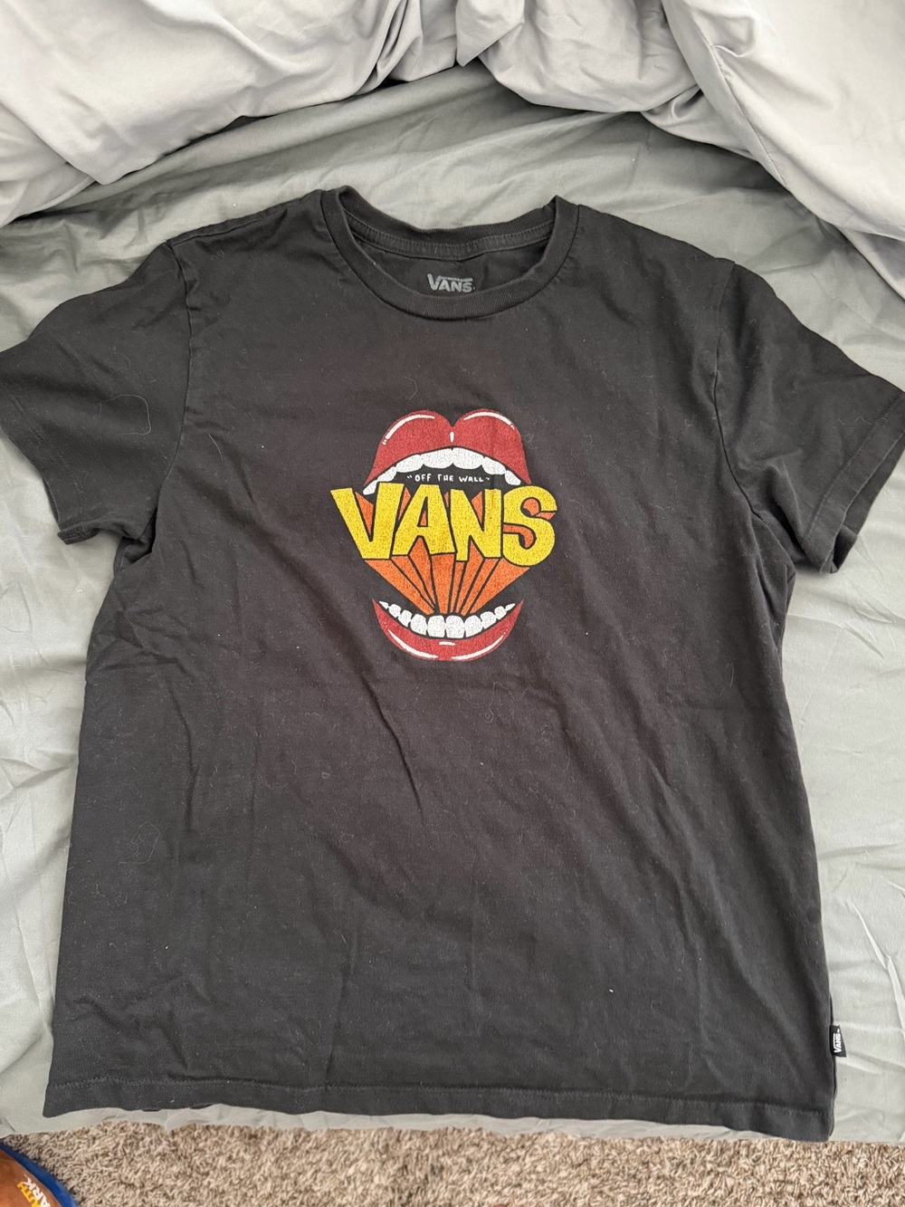 Vans black t-shirt with red lips graphic and yellow 'VANS' text size small